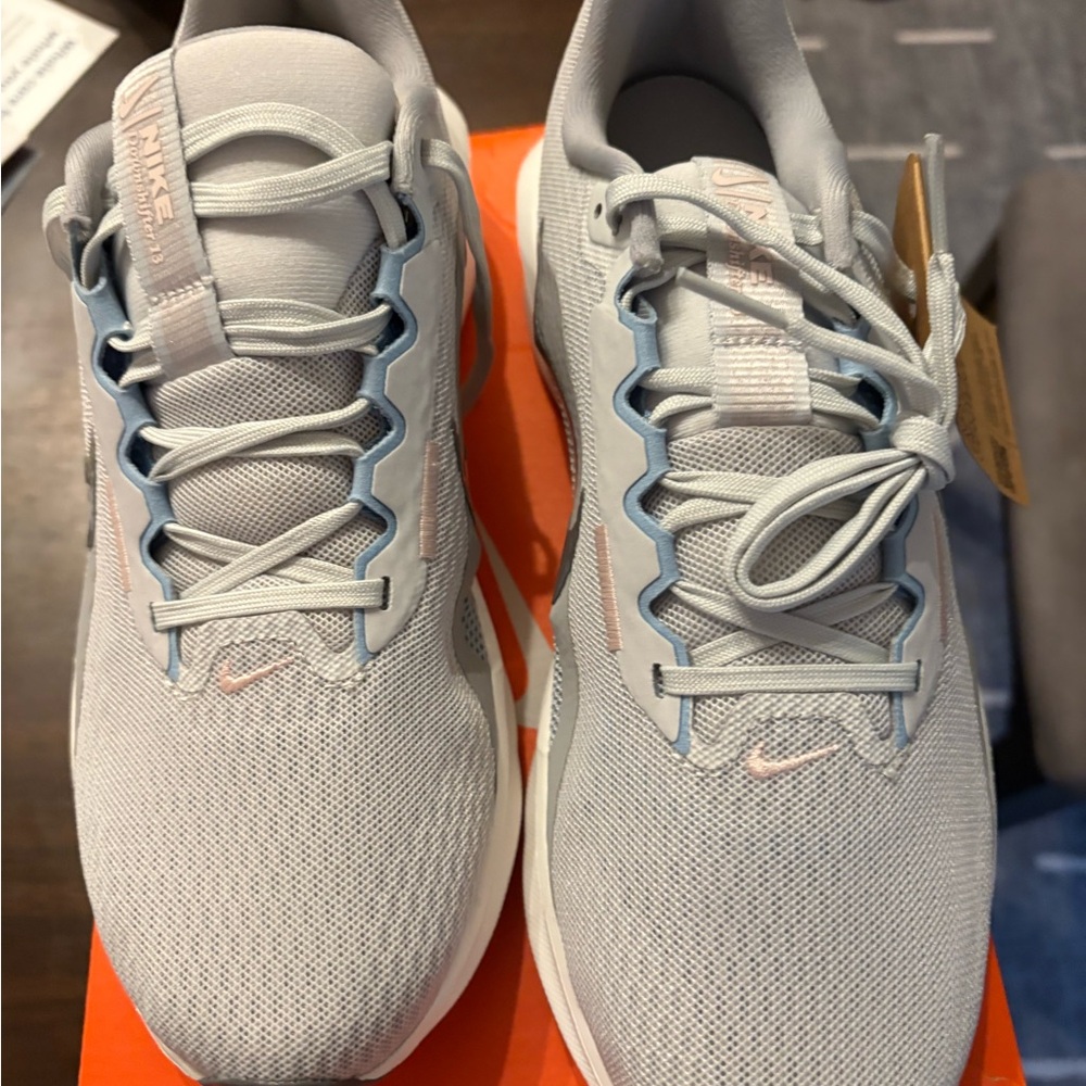 Nike Light Gray Mesh Sneakers with Pale Blue and Soft Pink Details